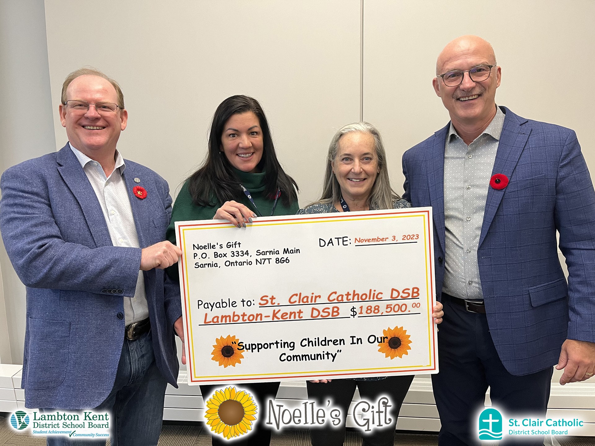 Noelle's Gift Cheque Presentation 2023 with Logos.jpg